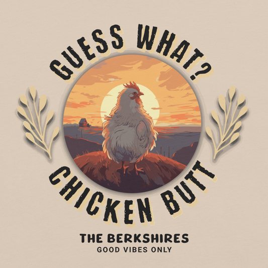 Tee shirt with chicken illustration and text 'Guess What? Chicken Butt The Berkshires Good Vibes Only' on a beige background.