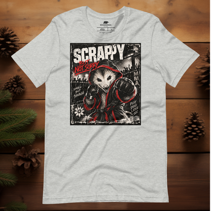 A light heather gray t-shirt with a graphic print of an opossum in a MMA style fighting robe punching,